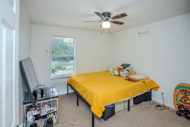 bedroom featuring ceiling fan and light carpet