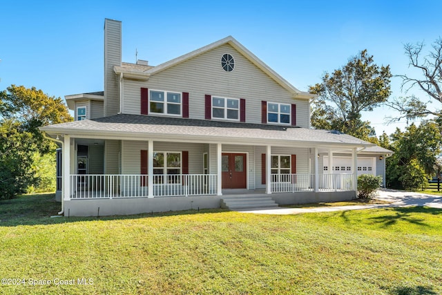 farmhouse inspired home featuring a garage and a front lawn