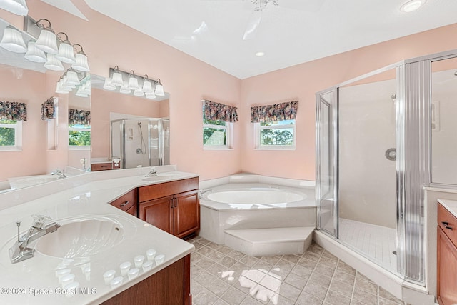 bathroom with ceiling fan, tile patterned flooring, vanity, and shower with separate bathtub