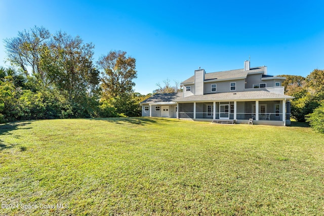 view of yard with a sunroom