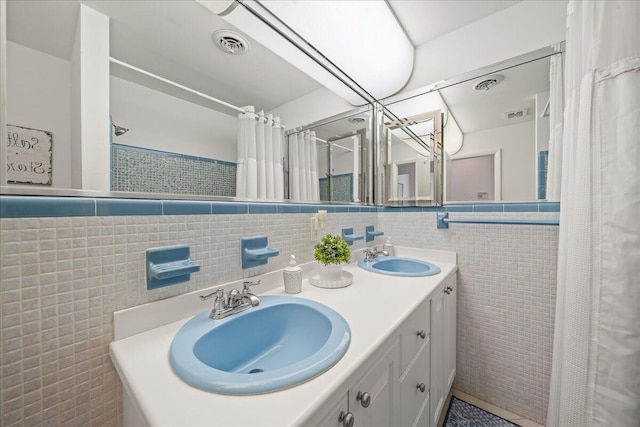 bathroom with vanity and tile walls