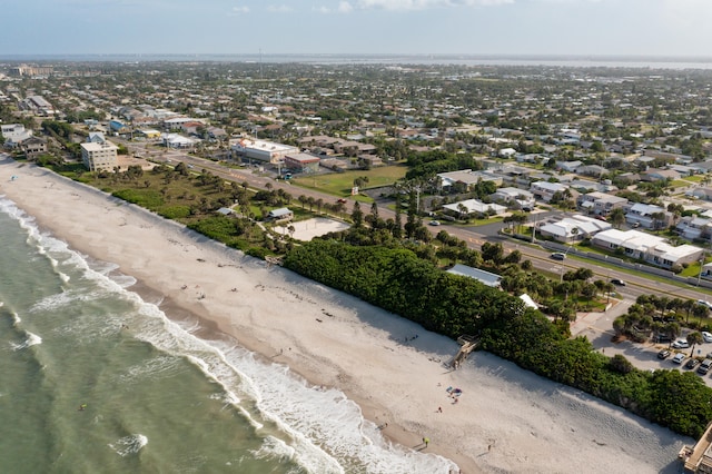 bird's eye view featuring a view of the beach and a water view