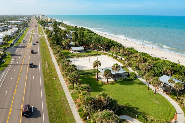 bird's eye view featuring a beach view and a water view