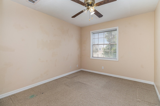 carpeted empty room with ceiling fan