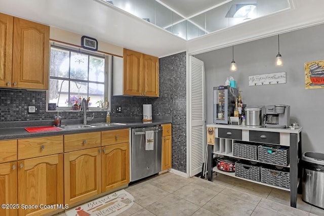 kitchen with tasteful backsplash, sink, light tile patterned floors, and appliances with stainless steel finishes