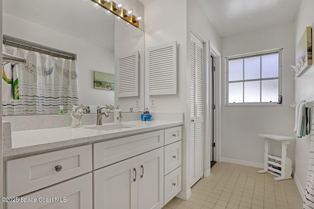 bathroom featuring vanity and tile patterned flooring