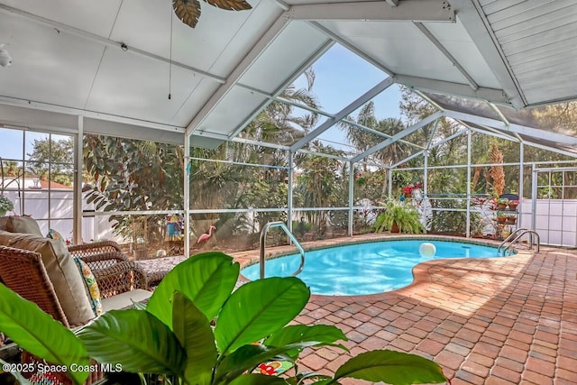 view of pool with a lanai and a patio