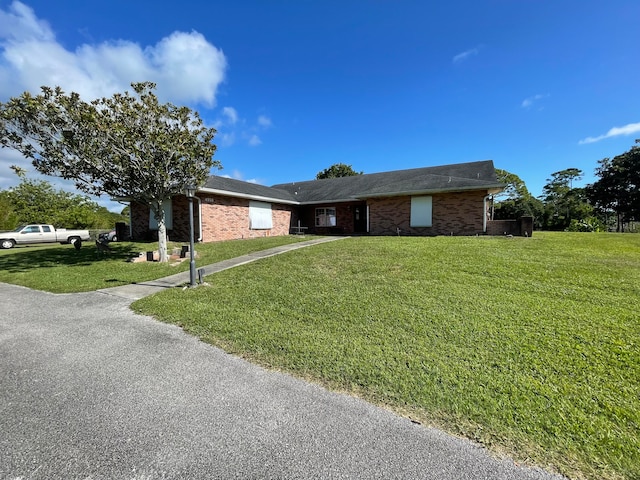 ranch-style home with a front yard