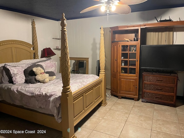 tiled bedroom with ceiling fan