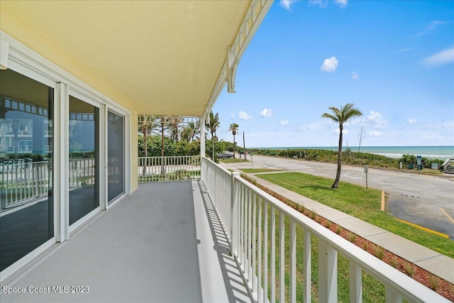 balcony featuring a water view