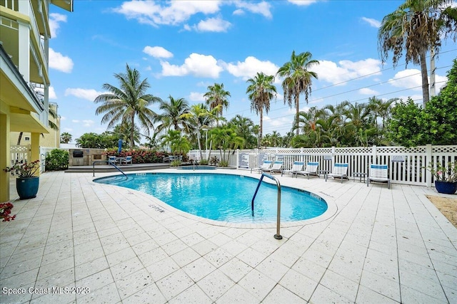 view of pool featuring a patio