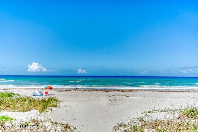 property view of water featuring a beach view