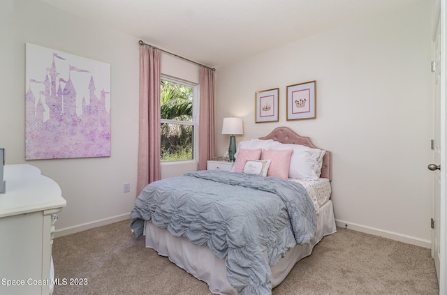 bedroom featuring light colored carpet