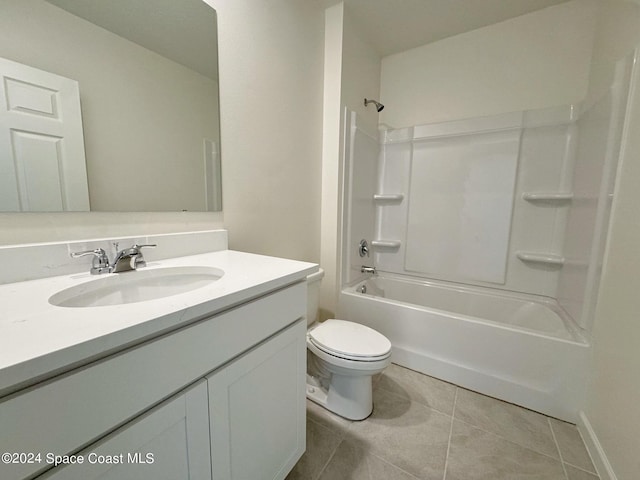 full bathroom with shower / bathing tub combination, vanity, tile patterned floors, and toilet