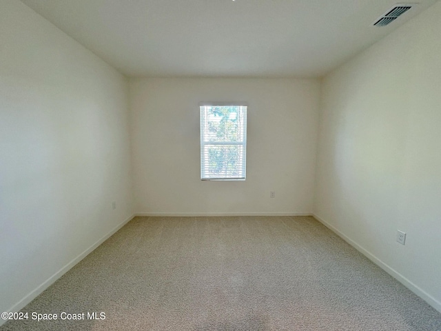 spare room with carpet floors