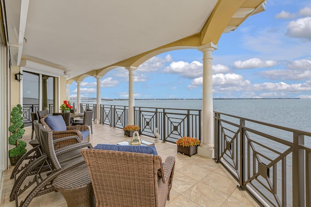 balcony featuring a water view