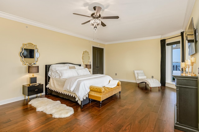 bedroom featuring dark hardwood / wood-style flooring, ornamental molding, and ceiling fan