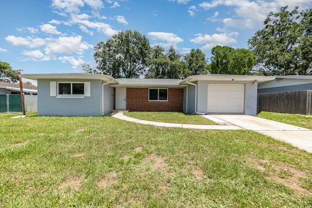 ranch-style house with a garage and a front lawn