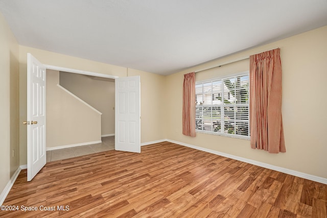 unfurnished room featuring light hardwood / wood-style floors