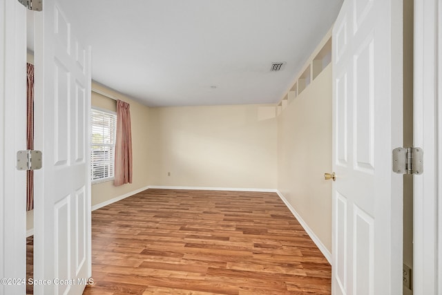 spare room featuring light hardwood / wood-style floors