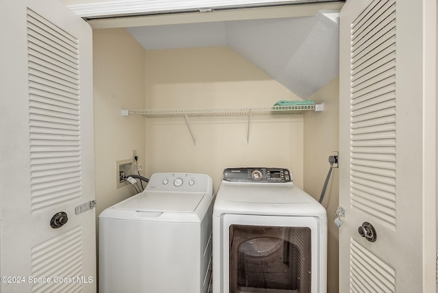 clothes washing area with separate washer and dryer