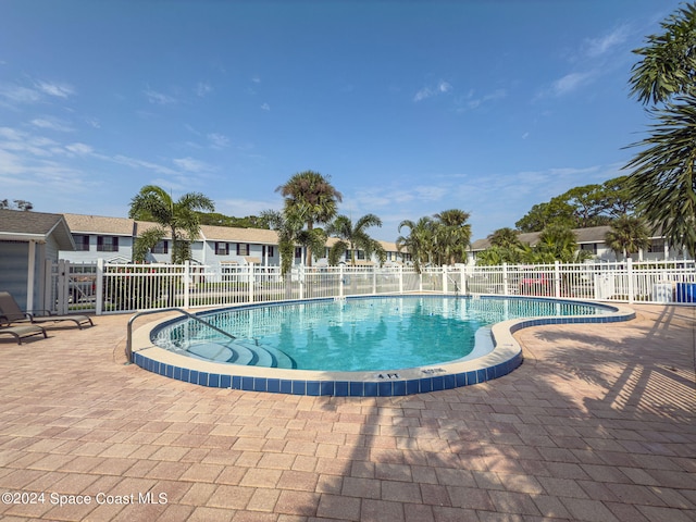 view of pool featuring a patio area