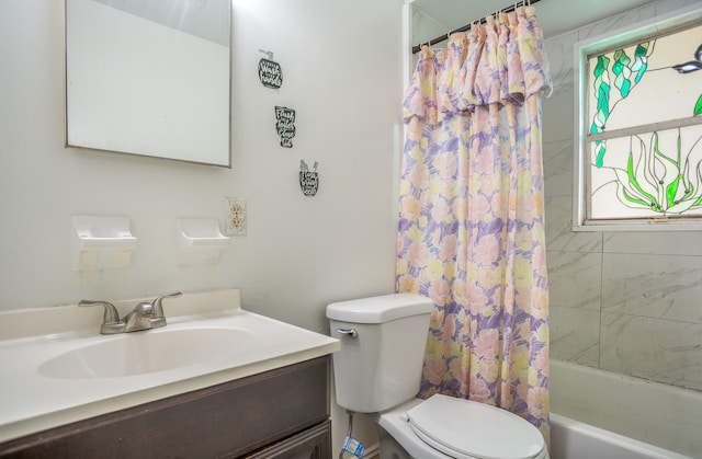 full bathroom with vanity, toilet, and shower / tub combo with curtain