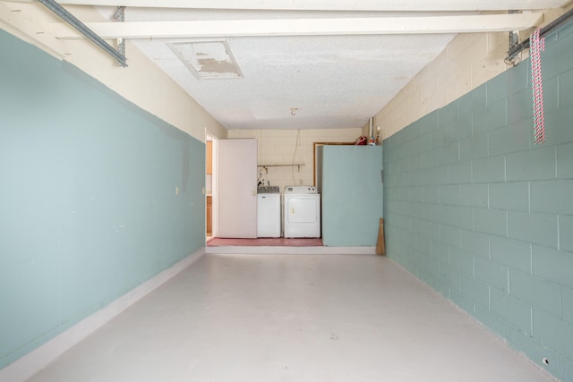 garage with washer and clothes dryer