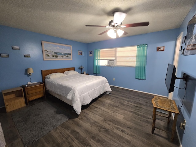 bedroom featuring dark hardwood / wood-style floors, a textured ceiling, and ceiling fan