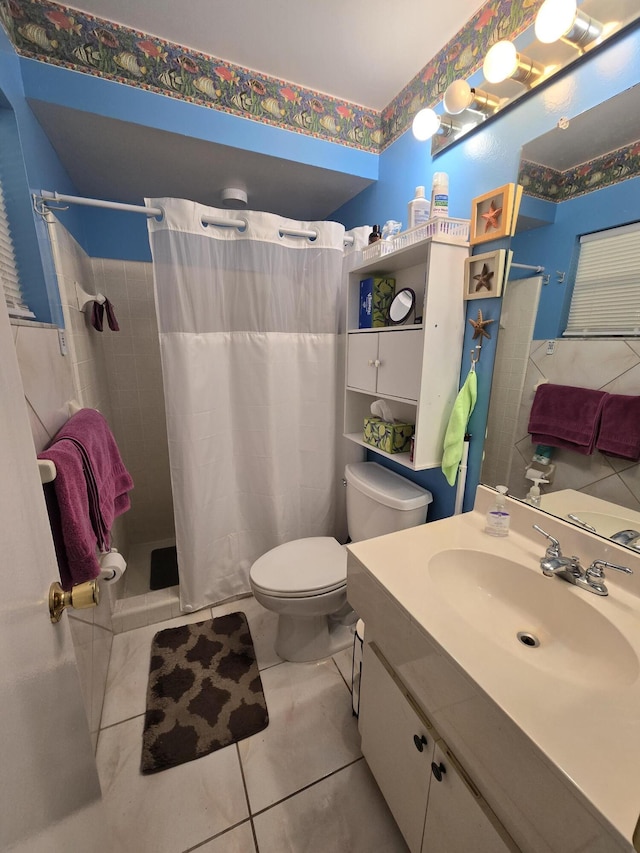 bathroom featuring vanity, toilet, curtained shower, and tile patterned flooring