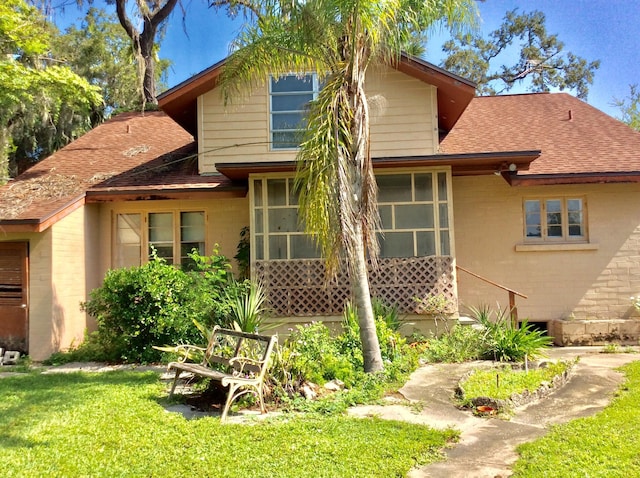 back of house with a yard