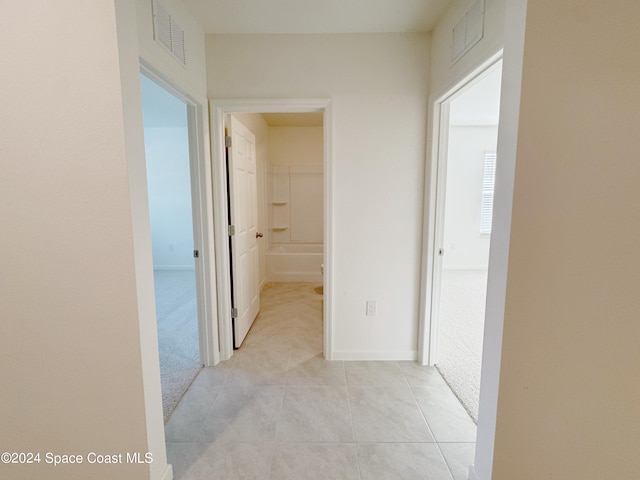 hallway with light carpet