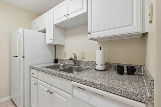 kitchen featuring light tile patterned floors, dishwasher, sink, and white cabinets