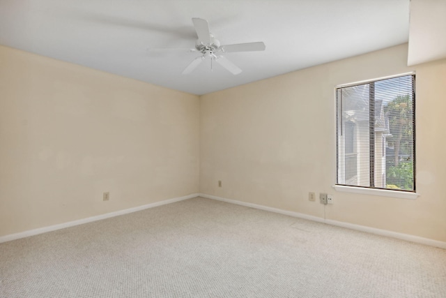 carpeted empty room with ceiling fan