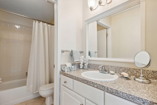 full bathroom featuring toilet, vanity, tile patterned floors, and shower / bath combo with shower curtain