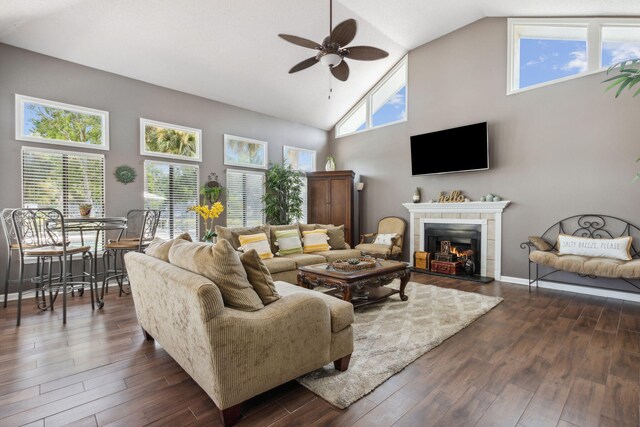 living room featuring plenty of natural light and dark hardwood / wood-style flooring