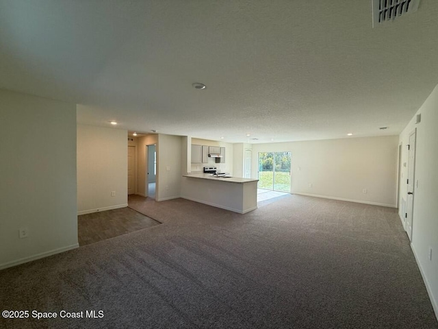 unfurnished living room with carpet floors