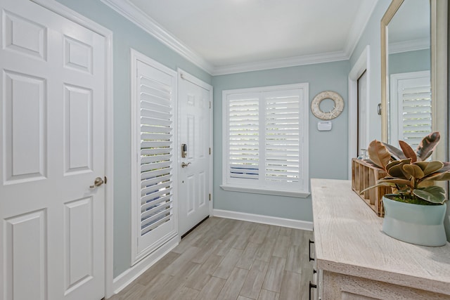 entrance foyer featuring light hardwood / wood-style floors and crown molding