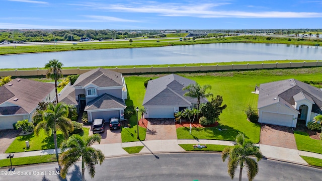 birds eye view of property with a water view