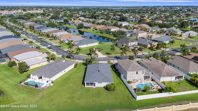 aerial view featuring a residential view and a water view