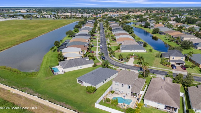 birds eye view of property featuring a residential view and a water view