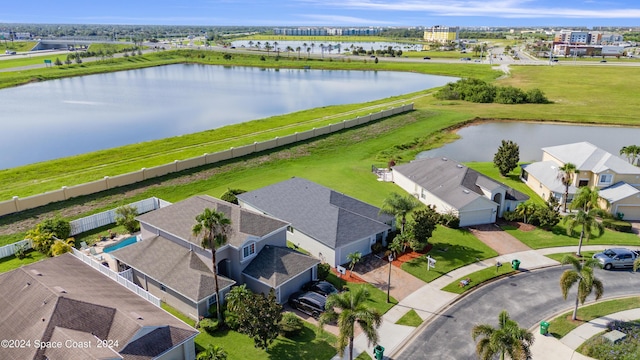 bird's eye view featuring a water view and a residential view