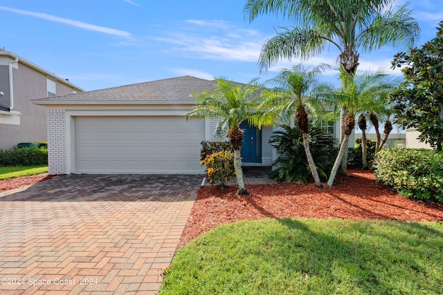 view of front of property with a garage