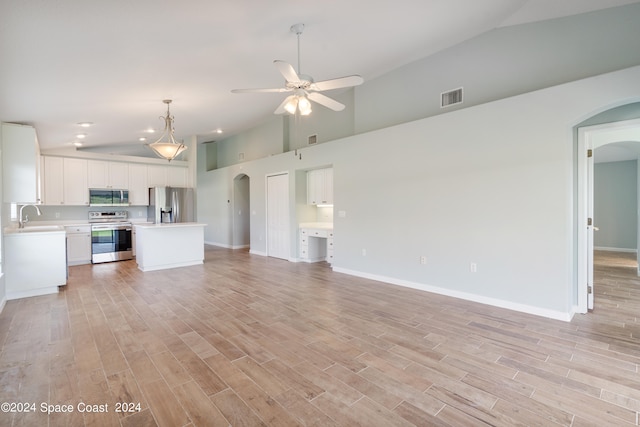 unfurnished living room featuring high vaulted ceiling, sink, ceiling fan, and light hardwood / wood-style floors