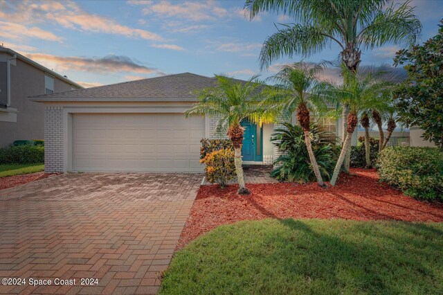 view of front of property with a garage