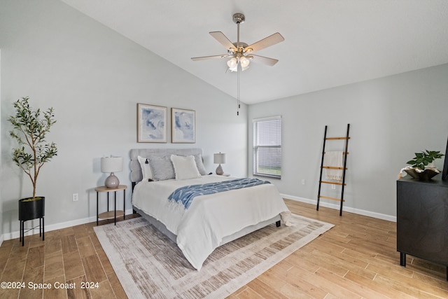 bedroom featuring vaulted ceiling, hardwood / wood-style floors, and ceiling fan