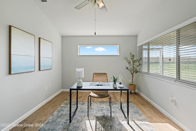 office space featuring lofted ceiling, ceiling fan, and hardwood / wood-style flooring