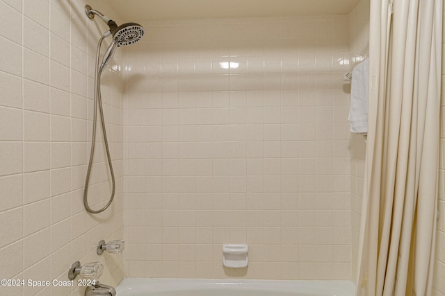 bathroom with shower / bath combination with curtain