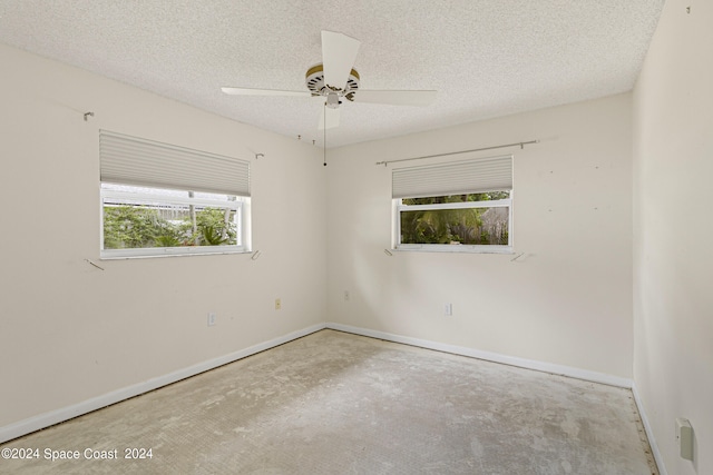 spare room featuring a textured ceiling and ceiling fan