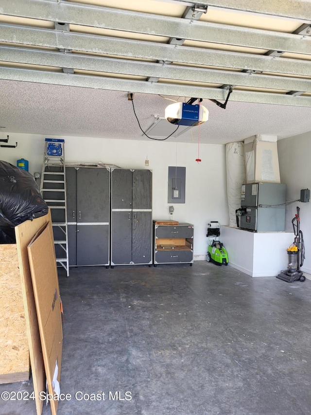 garage with a garage door opener and electric panel